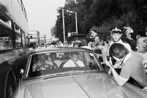 Muhammad Ali in the passenger seat makes his way through Coventry mobbed by fans Muhammad Ali in the passenger seat makes his way through Coventry mobbed by fans