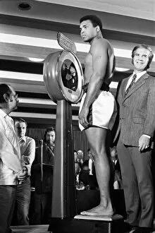 Images Dated 11th December 2012: Muhammad Ali on the scales prior to his fight with Alvin Lewis, aka Blue Lewis