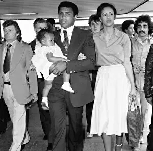 The Greatest Gallery: Muhammad Ali with second wife Veronica and their baby girl Hana arriving in England