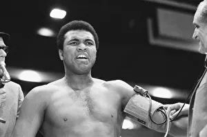 Portrait Posed Gallery: Muhammad Ali seen here having his blood pressure taken during thge pre fight medical
