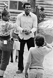 Muhammad Ali shares a joke with fans at his training camp in Pennsylvania