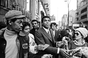 Muhammad Ali signing autographs ahead of his rematch with Joe Frazier