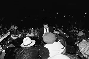 Muhammad Ali signing to enthusiastic fans in Handsworth Birmingham. 6th August 1983 Muhammad Ali signing to enthusiastic fans in Handsworth Birmingham. 6th August 1983