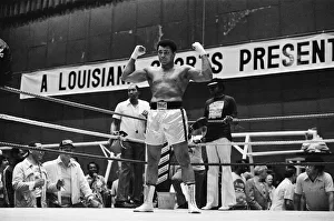 Muhammad Ali training posing for the cameras in Deer Lake Muhammad Ali training posing for the cameras in Deer Lake