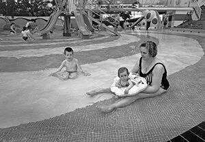 Images Dated 23rd May 1996: Mum and baby enjoy the shallow pool at The Suncentre, Rhyl
