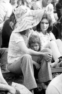 Music fan with young child at The Isle of Wight Festival. 30th August 1970 Music fan with young child at The Isle of Wight Festival. 30th August 1970
