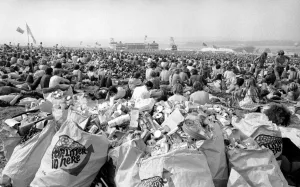 Music fans surrounded by empty cans at The Isle of Wight Festival. 30th August 1970 Music fans surrounded by empty cans at The Isle of Wight Festival. 30th August 1970