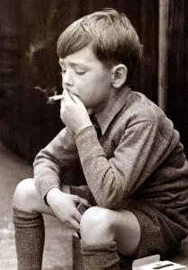 Naughty boy smoking a cigarette, circa 1950 Naughty boy smoking a cigarette, circa 1950