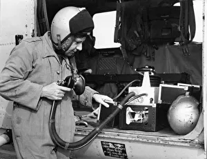 Navigator Steve Cawthorne of 202 Search and Rescue Squadron checks over the oxygen Navigator Steve Cawthorne of 202 Search and Rescue Squadron checks over the oxygen