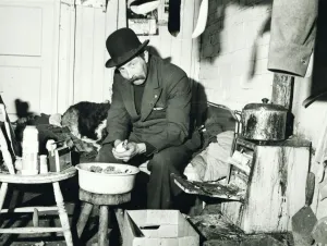 Ned Webb peeling a potato in his small room adjoining a disused stable on a deserted farm Ned Webb peeling a potato in his small room adjoining a disused stable on a deserted farm