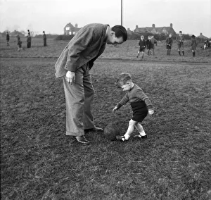 Neil Franklin, Stoke city FC and his baby son. January 1947 O6094 Neil Franklin, Stoke city FC and his baby son. January 1947 O6094
