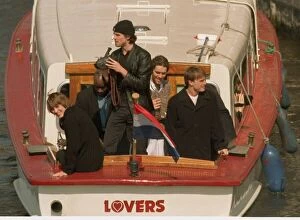 Images Dated 4th April 1996: Take That in the Netherlands after their final concert, leaving on a canal tazi as fans