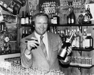 Award Ceremonies Gallery: New Manchester United football manager Ron Atkinson holds up a bottle of champagne in one