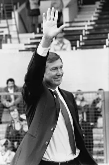 00468 Gallery: New Manchester United manager Alex Ferguson waves to the crowd before his first match in