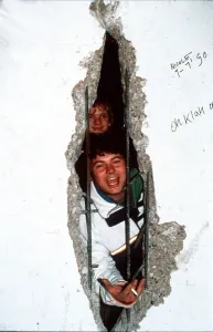New Year in Berlin, 1989 - 1990, with a new view from the East through a hole in New Year in Berlin, 1989 - 1990, with a new view from the East through a hole in