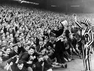 Newcastle United Gallery: Newcastle mascot Jimmy Nichol leads the cheers of the Newcastle crowd before the game