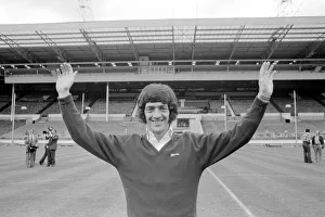00244 Gallery: Newcastle United footballer Terry Hibbitt gives the Geordie goal salute as he stands