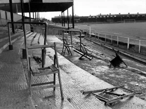 Newport Football Club. Terraces with grass, weeds and broken chairs Newport Football Club. Terraces with grass, weeds and broken chairs