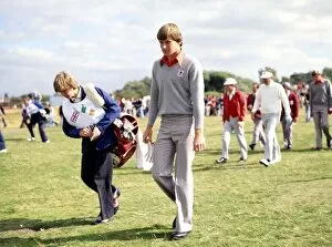 Nick Faldo with his caddy in the background his partner Peter Oosterhuis of the European