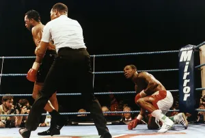 Nigel Benn Boxer Is Pulled Away By The Referee After Putting Chris Eubank On The Floor Nigel Benn Boxer Is Pulled Away By The Referee After Putting Chris Eubank On The Floor