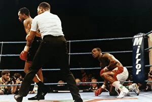 Images Dated 1st October 1993: Nigel Benn Boxer Is Pulled Away By The Referee After Putting Chris Eubank On The Floor