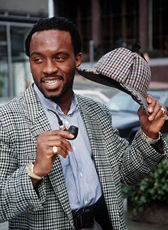 Nigel Benn intweed jacket holding hat and pipe March 1990 Nigel Benn intweed jacket holding hat and pipe March 1990