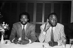 Nigel Benn (Right) with manager Ambrose Mendy. 6th July 1988 Nigel Benn (Right) with manager Ambrose Mendy. 6th July 1988