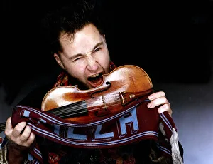 Nigel Kennedy Violinist Making to bite violin holding Aston Villa scarf Nigel Kennedy Violinist Making to bite violin holding Aston Villa scarf