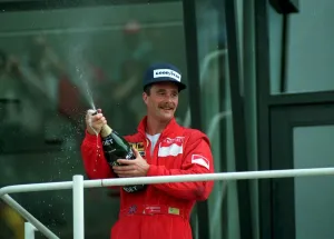 NIGEL MANSELL CELEBRATES WITH CHAMPAGNE AFTER BRITISH GRAND PRIX (89/3810 - 16117258 NIGEL MANSELL CELEBRATES WITH CHAMPAGNE AFTER BRITISH GRAND PRIX (89/3810 - 16117258