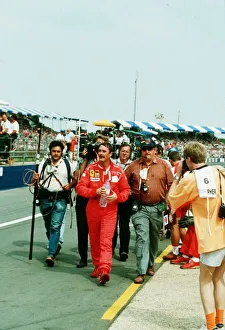 Nigel Mansell Motor Racing Driver Formula One F1 walks from the Silverstone Track after Nigel Mansell Motor Racing Driver Formula One F1 walks from the Silverstone Track after