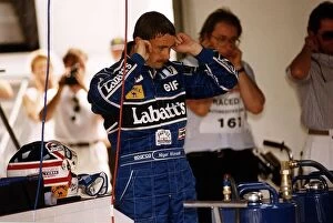 Nigel Mansell Motor Racing Driver Formula One F1 blocks his ears with his fingers while