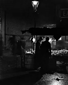 A night scene in Portobello Road market London. 8th October 1936 A night scene in Portobello Road market London. 8th October 1936