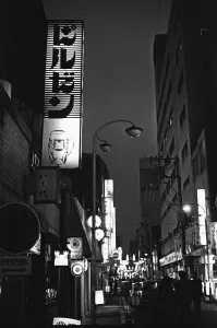 Night time in Ginza Tokyo's Nightclub District, where hostesses charm customers into Night time in Ginza Tokyo's Nightclub District, where hostesses charm customers into