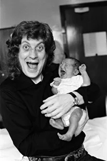 Images Dated 8th September 1978: Noddy Holder with his baby daughter Jessica. 8th September 1978