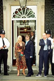 Images Dated 30th July 1997: Noel Gallagher and his girlfriend Meg Matthews at 10 Downing Street for a party held by
