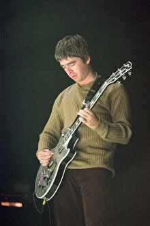 Images Dated 16th September 1997: Noel Gallagher of Oasis performing at Newcastle Arena during their Be Here Now Tour