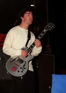 Noel Gallagher of the pop group Oasis on stage Sept 97 Noel Gallagher of the pop group Oasis on stage Sept 97