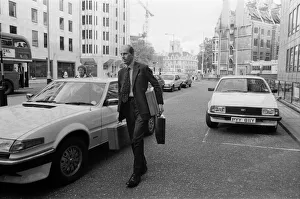 Norman Tebbit arrives with three despatch boxes at the Department of Trade, Victoria Norman Tebbit arrives with three despatch boxes at the Department of Trade, Victoria