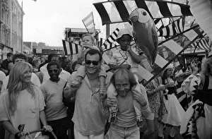 Notting Hill Carnival August 1987 Men, women and children enjopy the festival