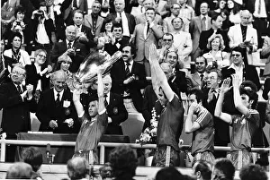 Nottingham Forest captain John McGovern lifts the trophy with team mates behind after Nottingham Forest captain John McGovern lifts the trophy with team mates behind after