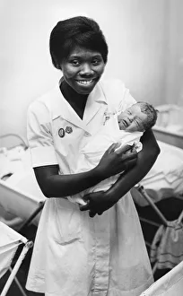 Nurse with a newborn baby at a hospital in Cambridge. Circa 1964 Nurse with a newborn baby at a hospital in Cambridge. Circa 1964