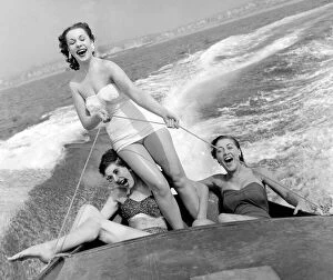 Watersports Gallery: Out on the ocean waves, August 1954 3 girls go for a spin on a speedboat in