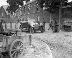 Officers showing their passes to Belgian peasants manning a road block on the road Officers showing their passes to Belgian peasants manning a road block on the road
