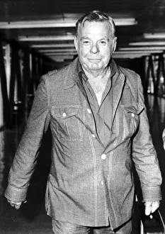 Oil rig firefighter Red Adair firefighter arriving at Heathrow airport. May 1977 Oil rig firefighter Red Adair firefighter arriving at Heathrow airport. May 1977