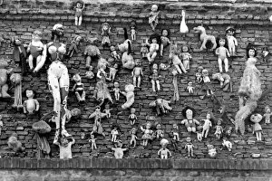 Old dolls on the wall of the Flea Market in Amsterdam. May 1975