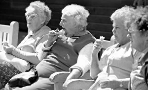 Images Dated 6th August 1977: Old ladies sitting on a bench eating ice cream during a day out to the beach at Trecco