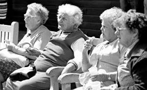 Images Dated 6th August 1977: Old ladies sitting on a bench eating ice cream during a day out to the beach at Trecco