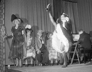 Old lady performs the can-can during a concert by pearly kings and queens Old lady performs the can-can during a concert by pearly kings and queens