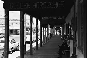 Images Dated 24th July 1976: Three old timers sit outside the Tombstone Drug store close to the site of the famous