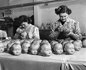 Outstanding workers painting the eyes in 900 dolls a day between them Outstanding workers painting the eyes in 900 dolls a day between them